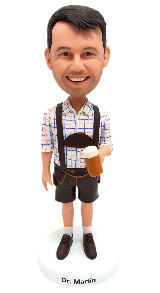 Custom bobblehead cake toppers in lederhosen shorts